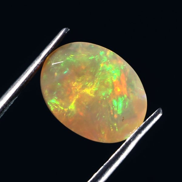 2.7 Cts Natural ethiopian opal faceted oval shape yellow gemstone - 392