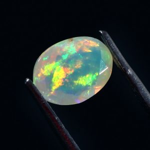 1.4 Cts Natural ethiopian opal faceted oval white gemstone - 399