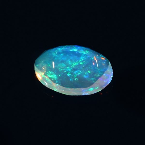 0.8 Cts Natural ethiopian opal faceted yellow gemstone oval shape - 395